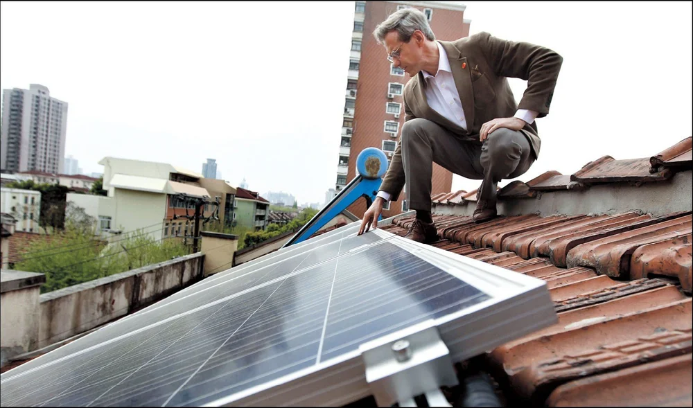 Jason Inch with solar panels on LOHAUS rooftop in Xuhui
